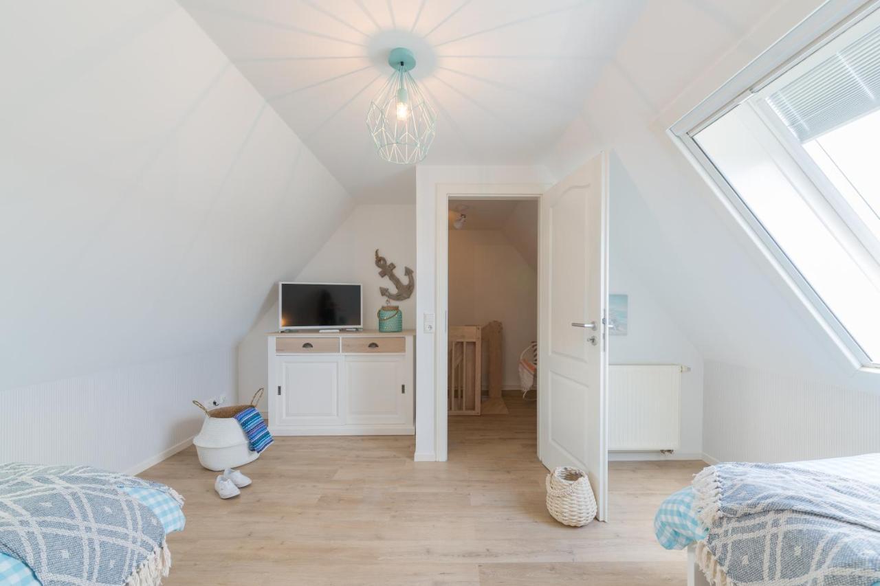 Ferienwohnungen Haus Am Strand ツィングシュト エクステリア 写真