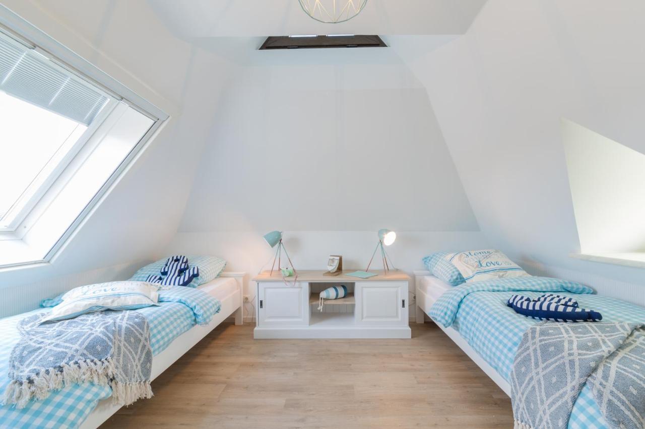 Ferienwohnungen Haus Am Strand ツィングシュト エクステリア 写真